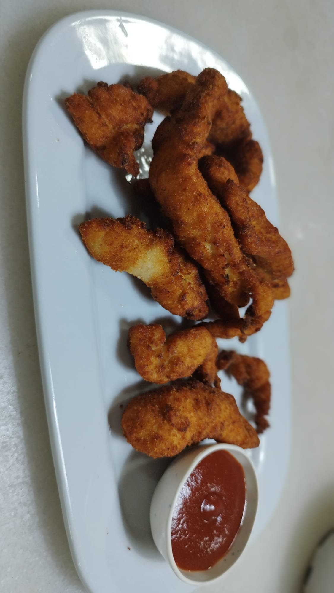 Lagrimitas de pollo con salsa barbacoa